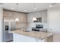 Modern kitchen featuring stainless steel appliances and granite countertops at 2025 Havasu Falls Ave, Deland, FL 32724