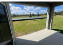 View from the back patio to the exterior of the home at 2214 Lake Preserve Cir, New Smyrna Beach, FL 32168
