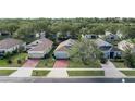 Aerial view of a residential neighborhood with multiple houses at 2311 Caledonian St, Clermont, FL 34711