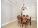 Dining room with a wooden table and chandelier at 2566 Ballard Ave, Orlando, FL 32833