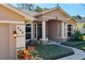 Front view of house showing entrance and address at 345 Via Bianca Dr, Davenport, FL 33896