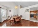 Dining room with hardwood floors and a wooden table at 3890 Waterview Loop, Winter Park, FL 32792