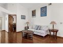 Living room with hardwood floors, a couch and end tables at 3890 Waterview Loop, Winter Park, FL 32792