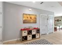 Bright entryway with storage bench and decorative wall art at 6030 Forest Ridge Ln, Winter Haven, FL 33881