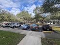 Condo community parking lot with cars and trees at 6100 Stevenson Dr # 105, Orlando, FL 32835