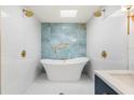 Modern bathroom featuring a large soaking tub and stylish tile at 6514 Quarter Horse Ln, Orlando, FL 32818