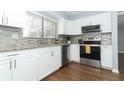 Modern kitchen with stainless steel appliances and granite countertops at 748 N Gretna Ct, Winter Springs, FL 32708