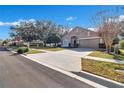 House exterior view, two-car garage, curb appeal at 900 Khingan Ct, Apopka, FL 32712