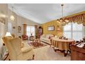 Cozy living room with seating area, dining table, and hardwood floors at 900 Khingan Ct, Apopka, FL 32712