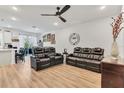 Spacious living room with leather sectional and hardwood floors at 914 Spring Palms Loop, Orlando, FL 32828