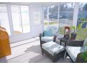 Bright sunroom with wicker furniture and large windows at 1401 W Highway 50 # 138, Clermont, FL 34711