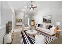 Bright living room featuring a comfy sofa and stylish rug at 161 Pinefield Dr, Sanford, FL 32771