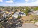 Aerial view of a house with a yard and neighborhood at 1950 Baton Rouge Ct, Orlando, FL 32818