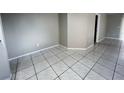 Bright living room features neutral walls and tile flooring at 2317 Santa Lucia St, Kissimmee, FL 34743
