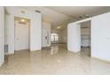 Bright and spacious living area with tile floors and access to the kitchen at 2543 Sage Dr, Kissimmee, FL 34758