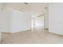 Open living room with tile floors and neutral walls at 2543 Sage Dr, Kissimmee, FL 34758