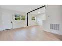 Spacious living area with new flooring and neutral wall colors at 2913 W Amelia St, Orlando, FL 32805