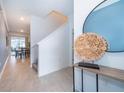 Bright and spacious entryway with tile flooring and modern decor at 2974 Protagonist St, Kissimmee, FL 34746