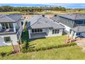 Aerial view of house backyard and golf course at 3032 Kensington Ave, Davenport, FL 33837