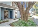 Townhome entrance with a large oak tree and walkway at 421 Sheoah Blvd # 5, Winter Springs, FL 32708