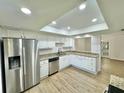 Bright kitchen with white cabinets, granite counters, and stainless steel appliances at 473 Oak Haven Dr # 473, Altamonte Springs, FL 32701