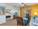 Living room with comfy seating, TV, and access to bedroom at 8101 Resort Village Dr, Orlando, FL 32821