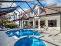 Enclosed pool and spa area with ample seating and clear views of the home's exterior at 9697 Bryanston Dr, Orlando, FL 32827