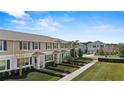 Modern townhome community with well-maintained landscaping at 16926 Reseda Aly, Winter Garden, FL 34787