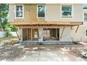 Home under construction with exposed framing, showing the progress of the renovation at 1705 Geigel Ave, Orlando, FL 32806