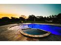 Luxury pool and spa with lighting, at sunset at 19229 E Peabody St, Orlando, FL 32833