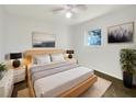 Light-filled bedroom with a wooden bed frame and ample floor space at 211 Palm Pl, Sanford, FL 32773