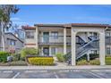 Two-story building exterior with balconies and stairs at 2419 Gallery View Dr # 10, Winter Park, FL 32792