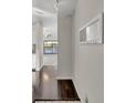 Bright entryway with dark hardwood floors and coat rack at 2419 Gallery View Dr # 10, Winter Park, FL 32792