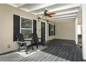 Relaxing front porch with two adirondack chairs and a ceiling fan at 2420 Musselwhite Ave, Orlando, FL 32804