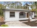 Newly renovated home features a screened porch at 25753 Vero St, Sorrento, FL 32776