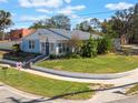 Nice curb appeal, light blue house with a spacious yard at 305 S Halifax Dr, Ormond Beach, FL 32176