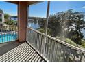 Relaxing screened balcony overlooking a pool and lake at 3250 Corona Village Way # 302, Orlando, FL 32835