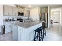 Modern kitchen featuring stainless steel appliances and granite countertops at 367 Caryota Ct, New Smyrna Beach, FL 32168