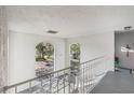 Bright hallway with arched windows overlooking the courtyard at 4302 Clubside Dr # 4302, Longwood, FL 32779