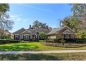 Beautifully landscaped yard with lush green lawn and elegant fountain under a bright blue sky at 812 Edgeforest Ter, Sanford, FL 32771