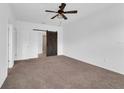 Spacious bedroom with carpeted floors and barn door at 1076 Taramundi Dr, Oviedo, FL 32765