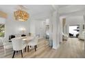 Elegant dining room with white table, chairs, and chandelier at 11401 Camden Park Dr, Windermere, FL 34786