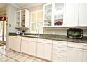 Bright kitchen with white cabinetry, granite countertops, stainless steel appliances, and ample natural light at 1821 Stanley St, Longwood, FL 32750