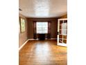 Bright living room featuring hardwood floors and a large window at 206 Tangerine Pl, Maitland, FL 32751