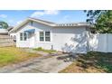 Charming one story home with a white exterior and a small yard at 4401 Santee St, Orlando, FL 32804