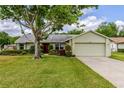 Charming home with a well-maintained lawn and landscaping at 4818 Breezy Palms Ct, Windermere, FL 34786