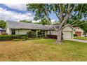 Charming home with a well-maintained lawn and landscaping at 4818 Breezy Palms Ct, Windermere, FL 34786