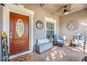 Inviting front porch with seating and decorative elements at 826 Seneca Trl, St Cloud, FL 34772