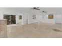 Spacious living room with beautiful tile floors, natural light, and an open floor plan at 1000 Winderley Pl # 143, Maitland, FL 32751