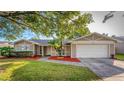 Charming ranch home featuring a well-manicured lawn at 1004 Bonita Dr, Altamonte Springs, FL 32714